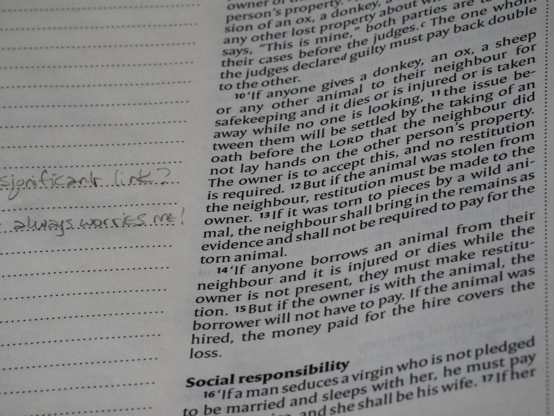 Close-up of a page from a book with handwritten notes.