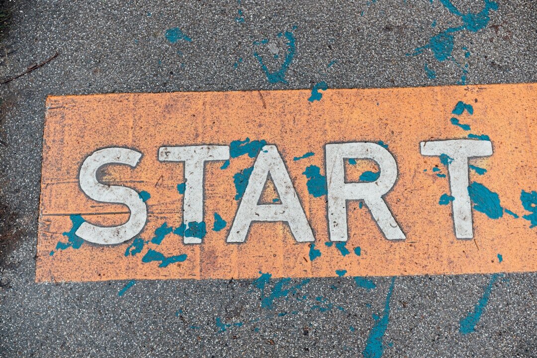 A close up of a street sign on the ground